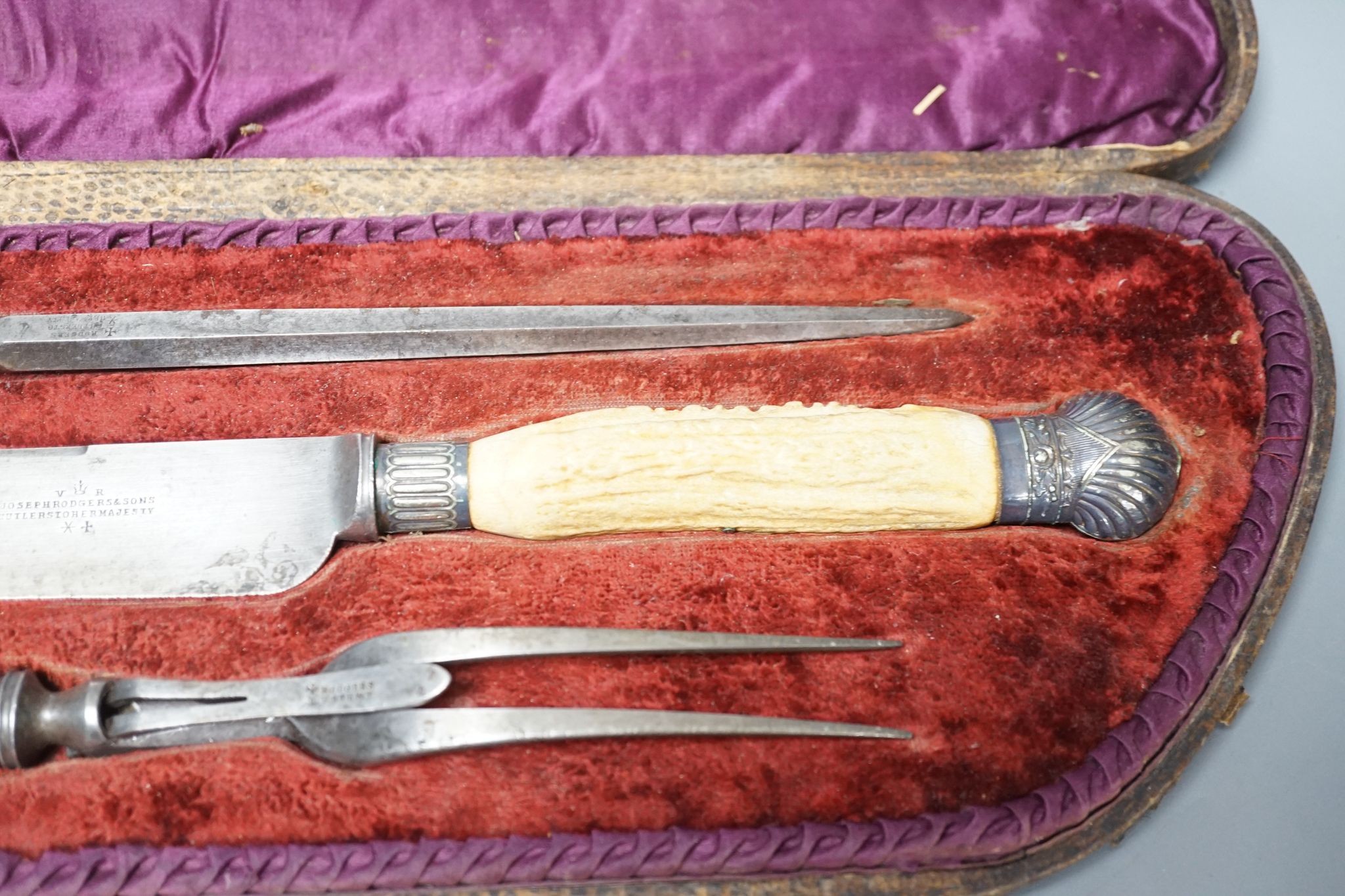 A stag horn handled three piece carving set, cased